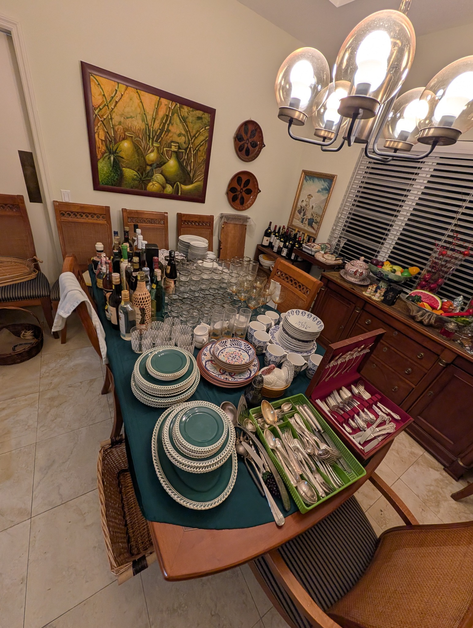 Dining room display with tableware, glassware, and serving pieces