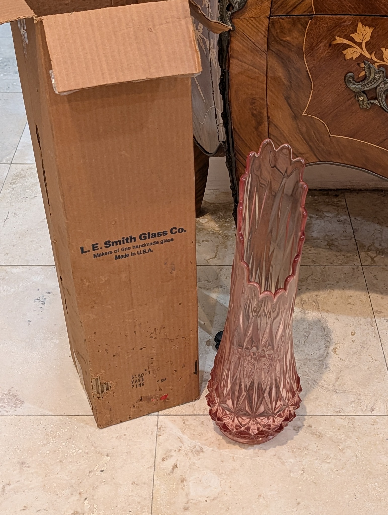 Pink glass vase beside an L. E. Smith Glass Co. box