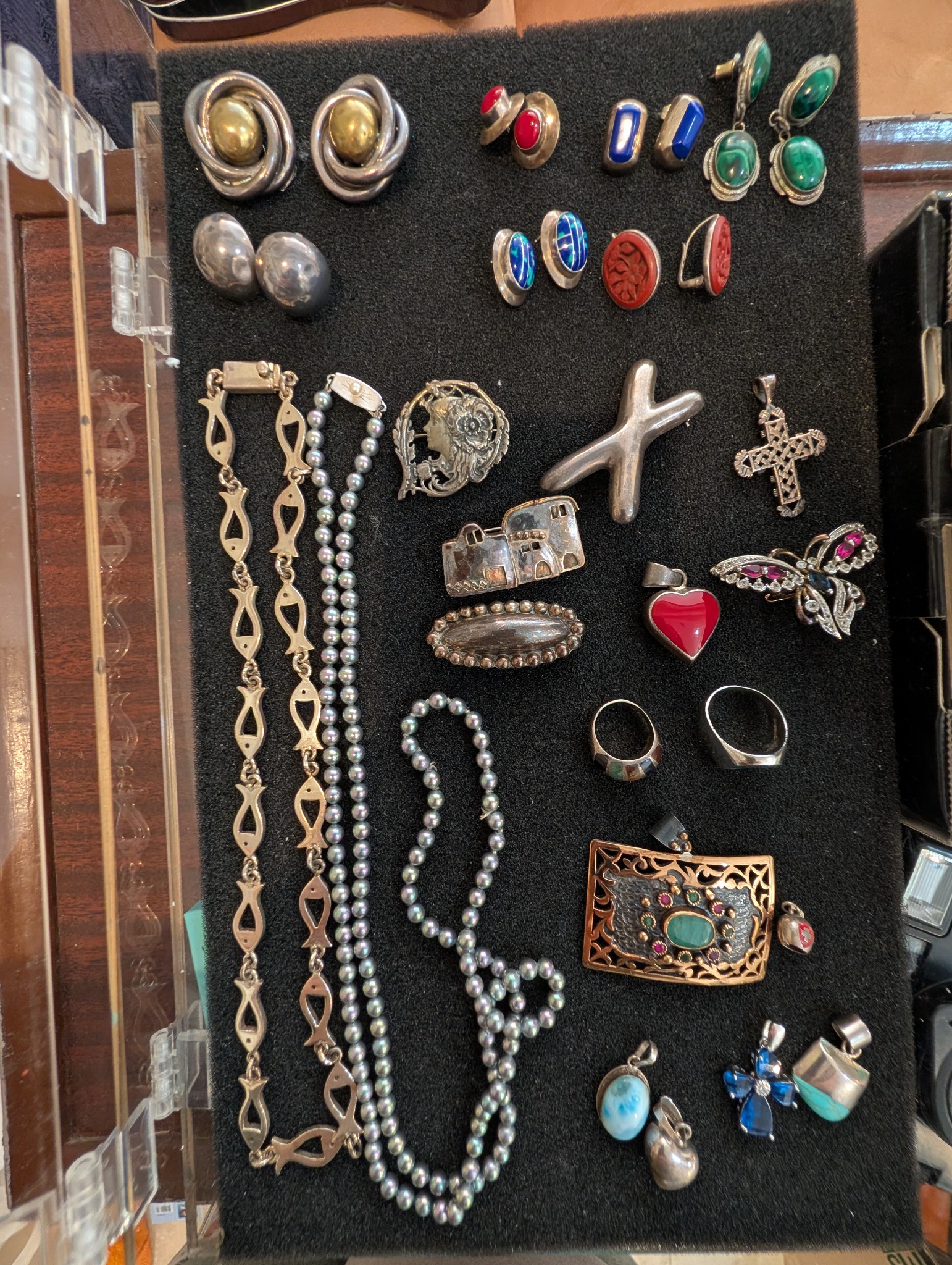 Jewelry display with earrings, necklaces, pendants, and rings
