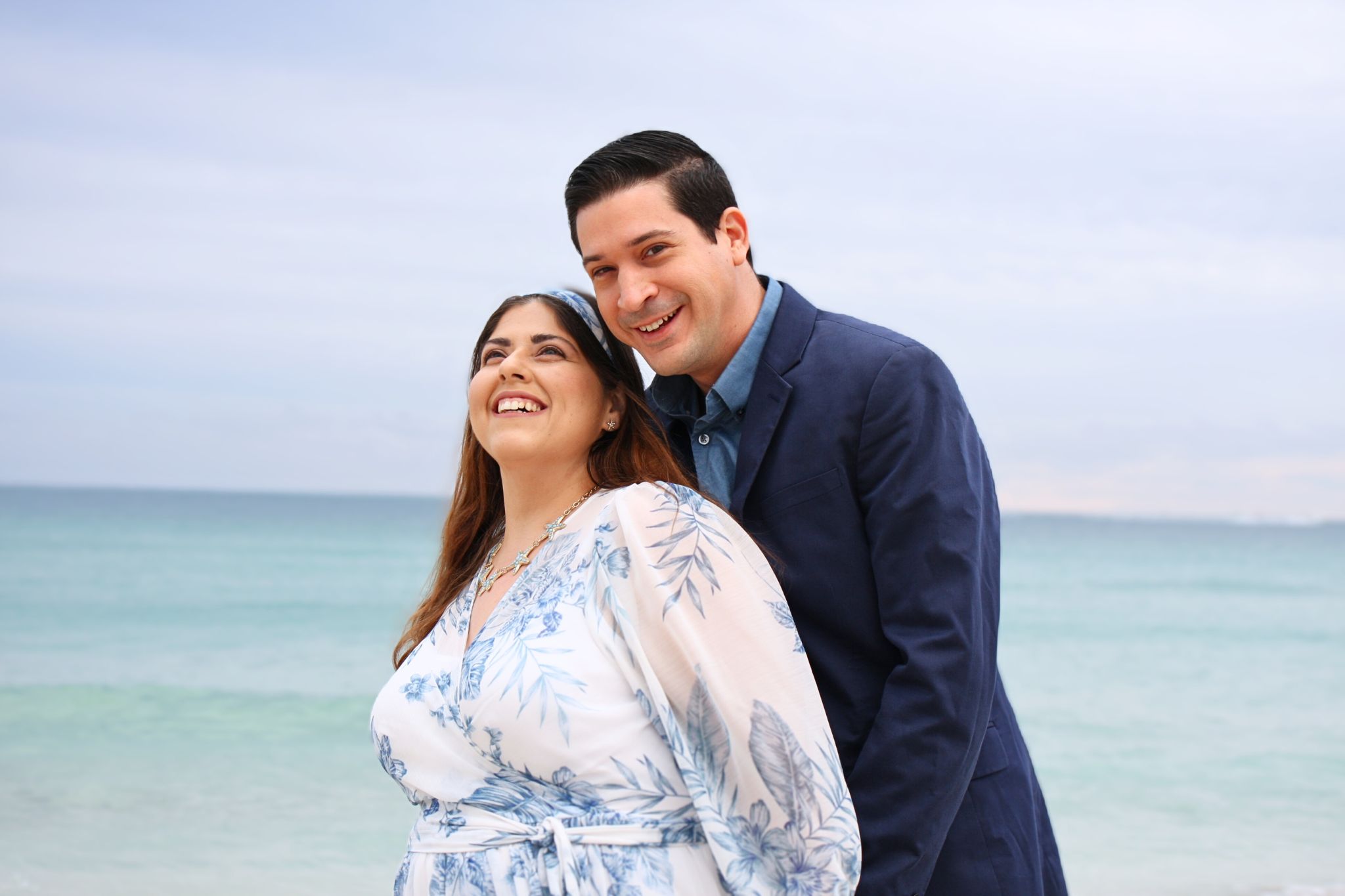 Dario and Luz, husband-and-wife owners of Soflo, smiling together by the ocean